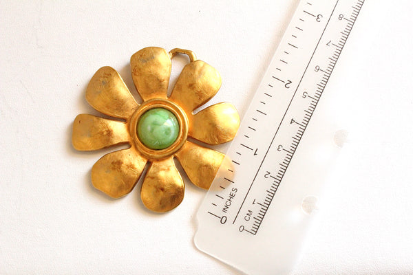 Signed Karl Lagerfeld Matte Goldtone Floral  pendant with green  cabochon #2880