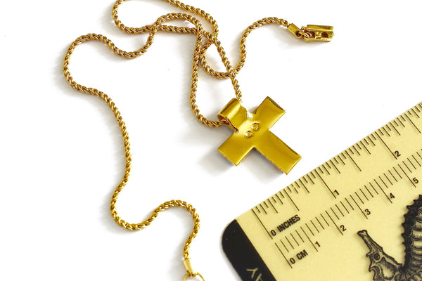 Swarovski gold tone chain with the cross shaped pendant Marked with Swan logo #976
